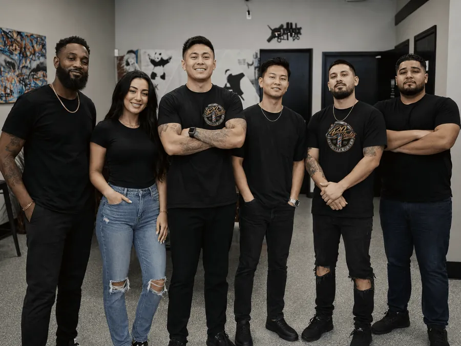 The 420 Fades team standing together in the shop.